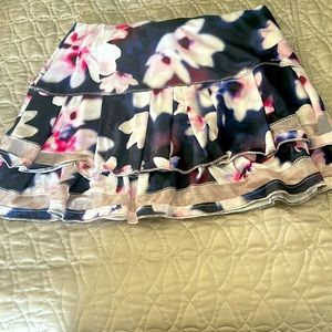 Lucky in love tennis skirt with sheer detailing on hem.  Barely worn-like new